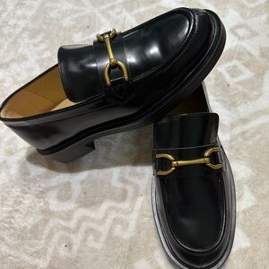 Tony Bianco Black Loafers with Gold Accent